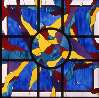 Leaded glass window with a radiating sunburst in cobalt, amber and crimson