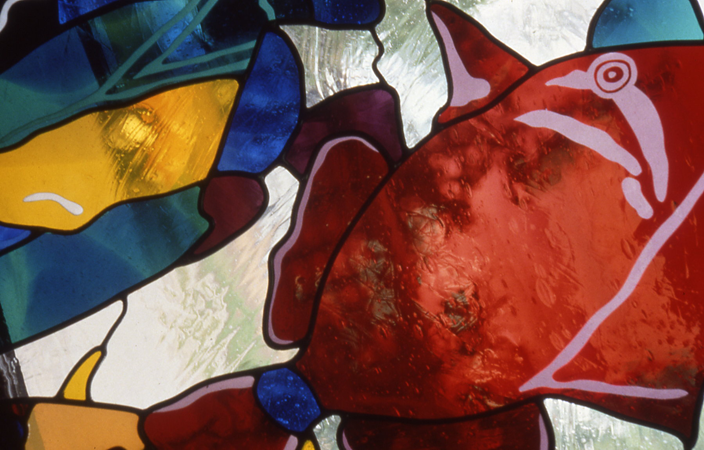 Leaded glass detail in crimson, gold and cobalt